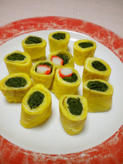 A picture of Rolled Omelette with Seasoned Spinach.