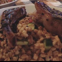 A picture of Lamp chop over Farro.