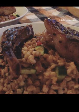 A picture of Lamp chop over Farro.