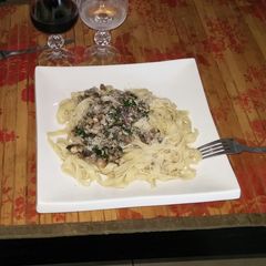 A picture of Fresh mushrooms spicy pasta sauce.