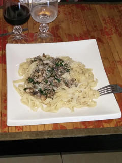 A picture of Fresh mushrooms spicy pasta sauce.
