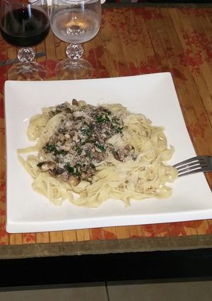 A picture of Fresh mushrooms spicy pasta sauce.