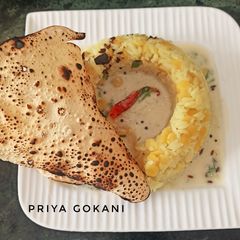 A picture of Tadka Khichdi with Gujurati Kadhi.