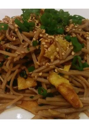 A picture of Soba - Oriental noodles with scallions.