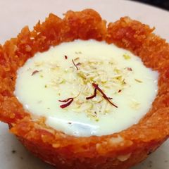 A picture of Gajar halwa cups with rabdi.