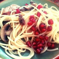 A picture of Pasta with fried mushrooms and chicken..