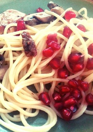 A picture of Pasta with fried mushrooms and chicken..