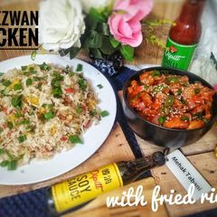A picture of Schezwan chicken with fried rice.