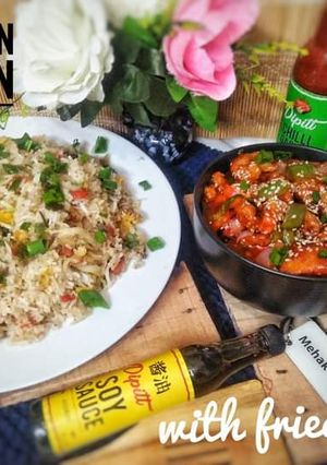 A picture of Schezwan chicken with fried rice.