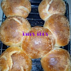 A picture of Homemade bread with sprinkled coconut.