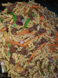 A picture of Stir fried beef pasta.