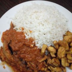 A picture of White rice with dryfish stew/ plaintain.
