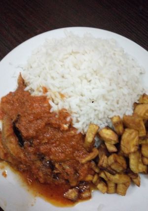 A picture of White rice with dryfish stew/ plaintain.