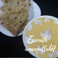 A picture of Creamy Aamras with Rotis.