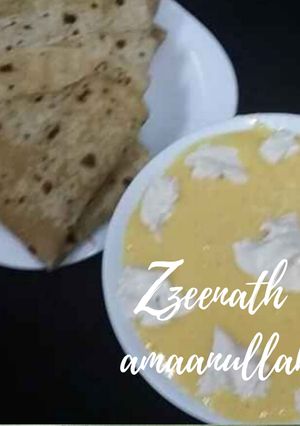 A picture of Creamy Aamras with Rotis.