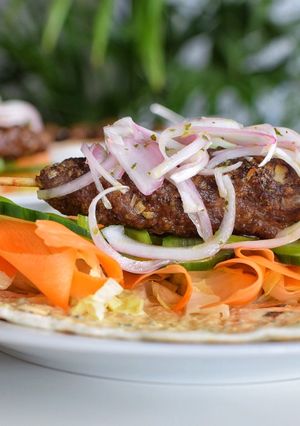 A picture of KOFTA KEBAB on Skewers in the Oven.