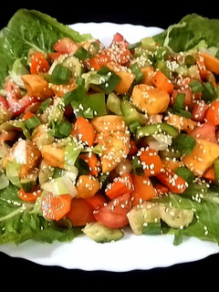 A picture of Mango salad with pomegranate molasses dressing.
