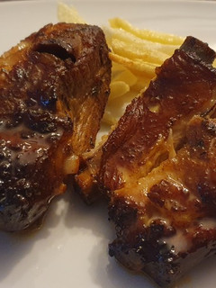 Una foto de Costillas al horno con Chimichurri