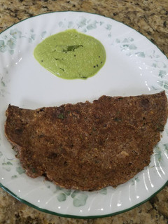 A picture of Oats & ragi roti/thick pancake.
