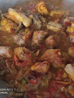 Una foto de Conejo en salsa de verduras y vino