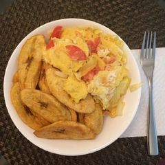 A picture of Fried unripe plantain with fried egg.