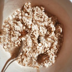 A picture of Oatmeal with coconut oil and honey.