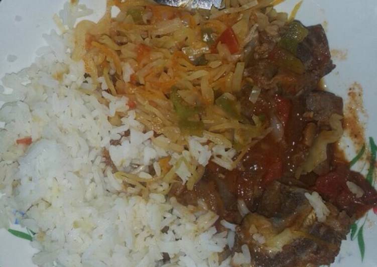 Boiled rice served with cabbage and beef stew