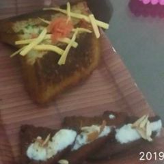 A picture of Bread cheesy sandwich with bread khasta jalebi.