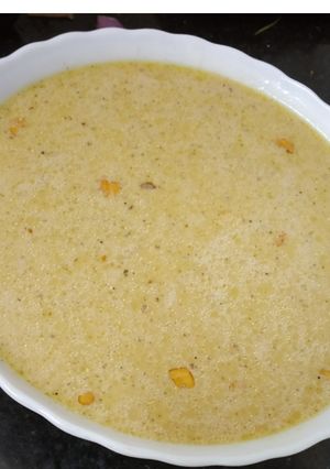 A picture of Brown rice flakes payasam using brown sugar.