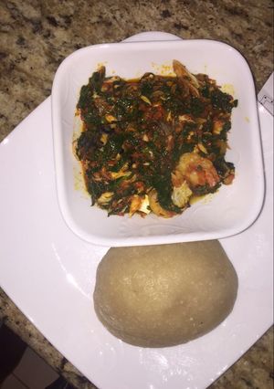 A picture of Efo riro with fish and shrimps.