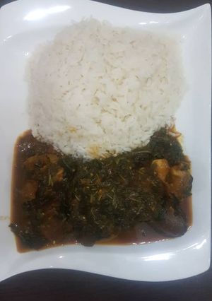 A picture of Vegetable soup paired with rice.