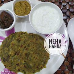 A picture of Drumstick(sahjan) leaves paratha with drumstick chutney.