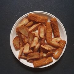 A picture of Triple cooked deep fried Chips and Fish Fingers.