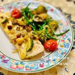A picture of White fish with vegetable, mushroom and samphire sauce.