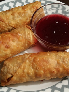 A picture of Thanksgiving Egg Rolls w/ Sweet&Sour Cranberry Sauce.