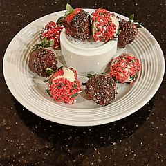 A picture of Holiday White and Dark Chocolate covered Strawberries.