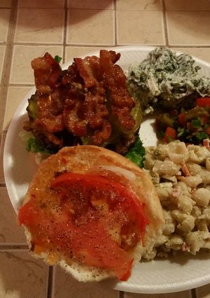 A picture of Chedder Stuffed Bacon Burger with Red Pepper Jelly.
