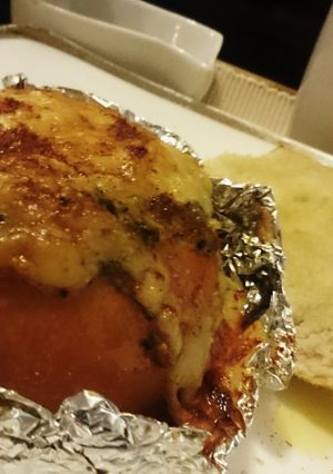 A picture of Baked Tomato,stuffed with Egg,Spinach n Ham.