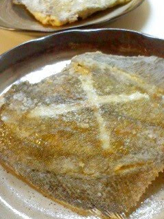 A picture of Deep-fried Flounder Fish Made in a Frying Pan.