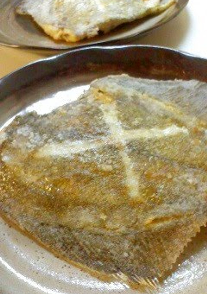 A picture of Deep-fried Flounder Fish Made in a Frying Pan.