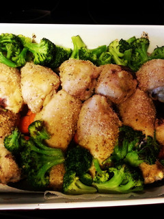 A picture of Roasted Chicken, potatoes and veggies.