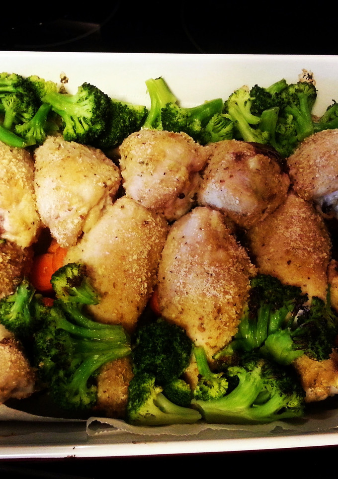 A picture of Roasted Chicken, potatoes and veggies.