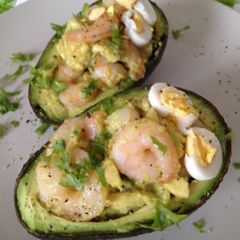 A picture of Stuffed Avocado with Garlic Shrimp.
