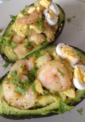 A picture of Stuffed Avocado with Garlic Shrimp.