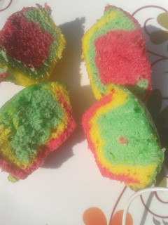 A picture of Rainbow cupcakes.