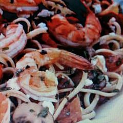 A picture of Linguini w/shrimp and plum tomatoes.