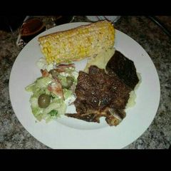 A picture of Grilled meat and salads.