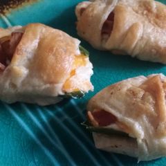 A picture of Stuffed jalapeño roll-ups.