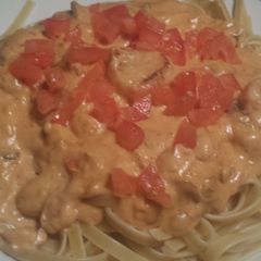 A picture of Blacken tilapia with fettuccine.