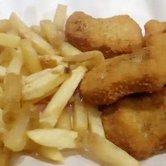 Chicken nuggets with french fries A picture of Chicken nuggets with french fries.